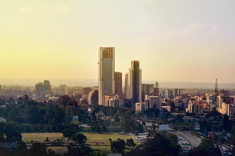 Nairobi city skyline at golden hour with parkland in the foreground
