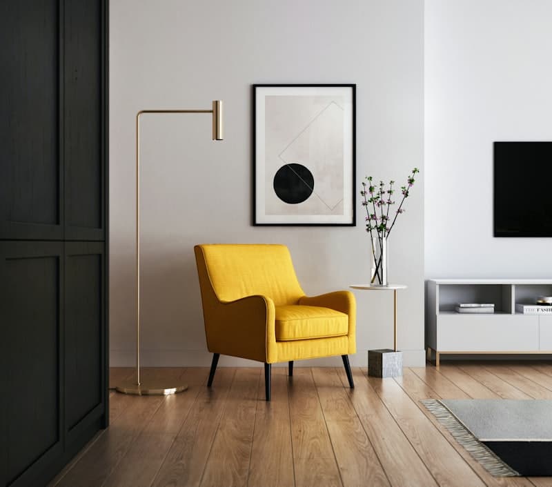 Sunny living room corner with a yellow armchair and footstool